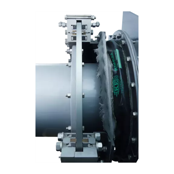 Fabric expansion joint installed in an industrial piping system to absorb thermal expansion, vibration, and mechanical movement.