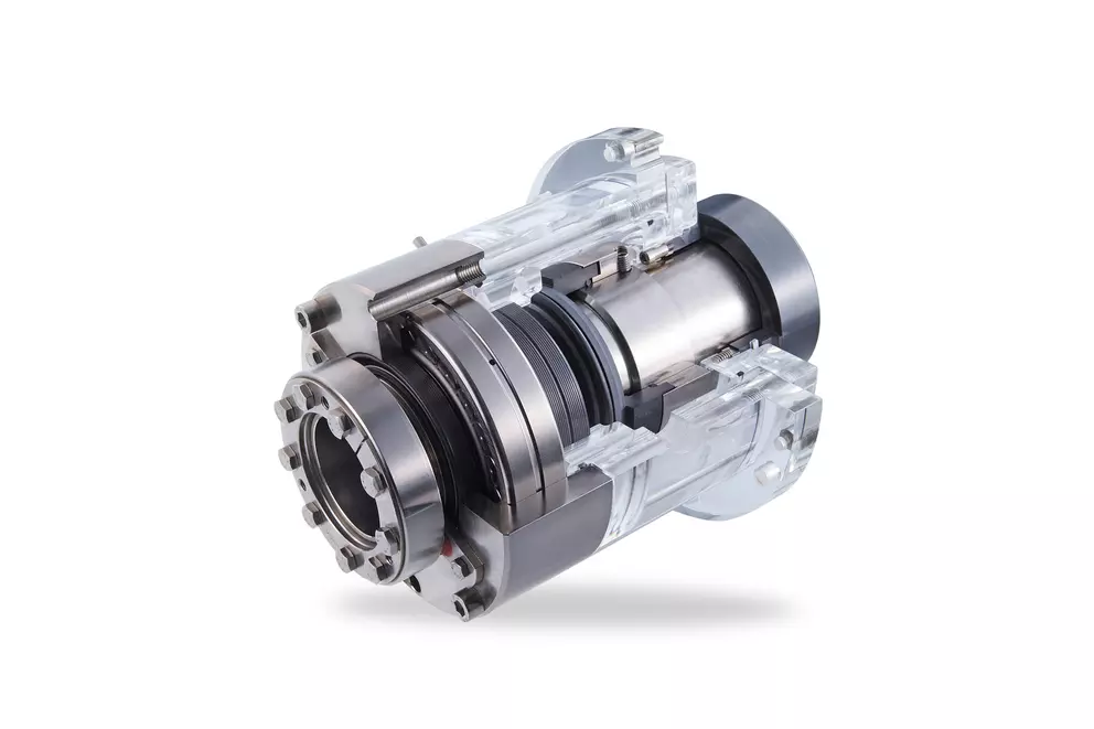A cross-sectional view of a mechanical seal assembly, showing internal components made of metal and transparent materials, used in rotating equipment to prevent leakage.