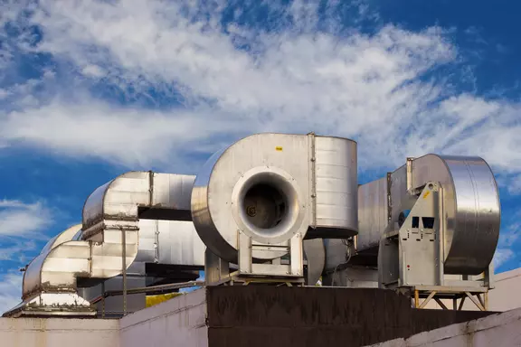 Industrial air handling and ventilation units installed on a rooftop.