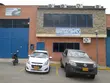 EagleBurgmann facility exterior with company signage, parked vehicles, and industrial building facade, highlighting local site presence and service operations.