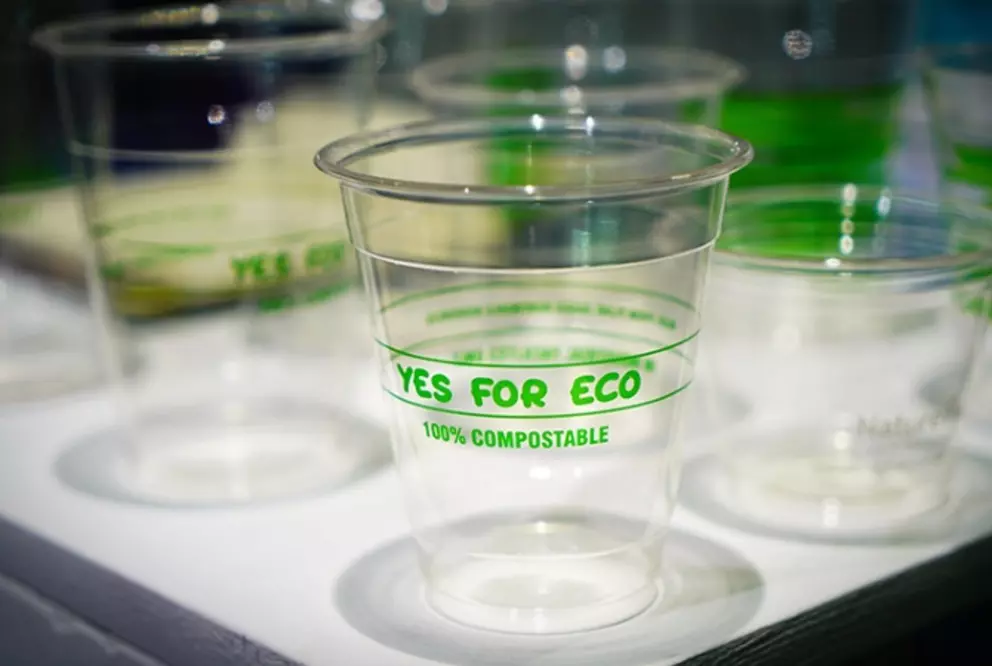 Clear compostable cup labeled 'Yes for Eco' promoting sustainable, biodegradable packaging.