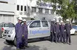 EagleBurgmann service team standing beside a branded company vehicle outside an industrial facility, highlighting field service capability, workforce presence, and on-site technical support.