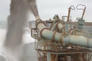 Pipeline system of a suction dredger discharging sediment and water.