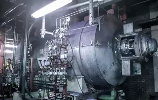 Industrial process system with large horizontal vessel and instrumentation.
