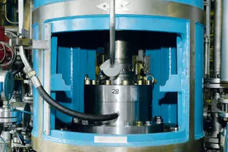 Industrial equipment with an agitator seal and stainless-steel components in a processing plant.