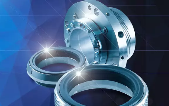 A digitally enhanced studio image featuring disassembled mechanical seal components, including two separate sealing rings and a larger, metallic, bolted flange assembly, set against a glowing blue background.