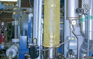 Industrial process system with instrumentation, piping, and technical components.