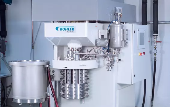 Industrial process machine with stainless steel components and integrated control unit.