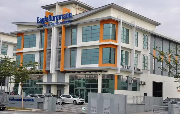 EagleBurgmann office building with modern architecture, large glass windows, and prominent company signage in a commercial setting.