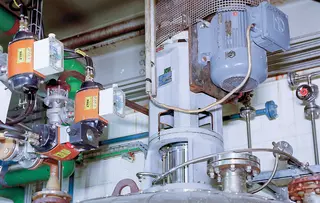Industrial process system with motor, valves, and connected piping.
