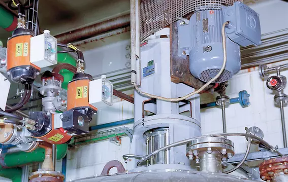 Industrial process system with motor, valves, and connected piping.