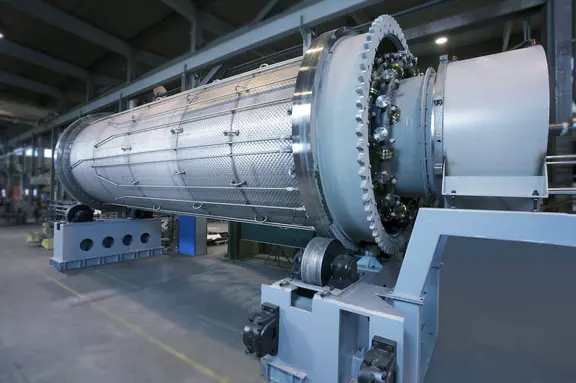 Large industrial rotary machine in a manufacturing facility.